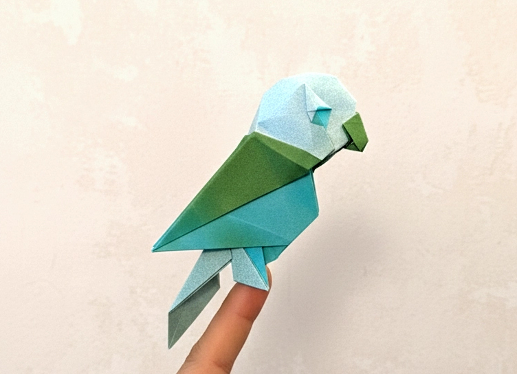 Origami Parakeet designed by Syn / Jiahui Li, folded by TERRY Nicolas, using Luminous Thai paper (#10 WHITE / GREEN BLUE)