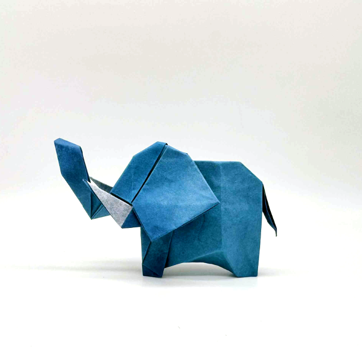 Origami Elephant designed by syn, folded by Syn / Jiahui Li, using Luminous Thai paper (#04 WHITE / BLUE JEAN)