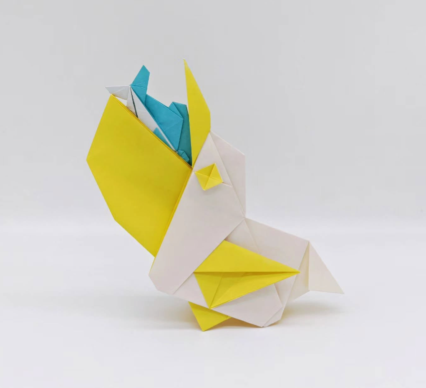 Origami Pelican designed by Yanhui Lai, folded by Yanhui Lai, using Duo Extra Large paper (#12 Yellow)