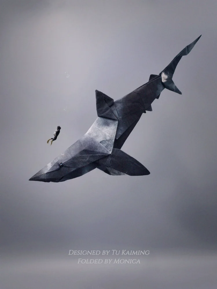 Origami Shark designed by Tu Kaiming, folded by Monica Xing Gao, using Shadow Thai paper (#15 BLACK / BLACK with WHITE spots)