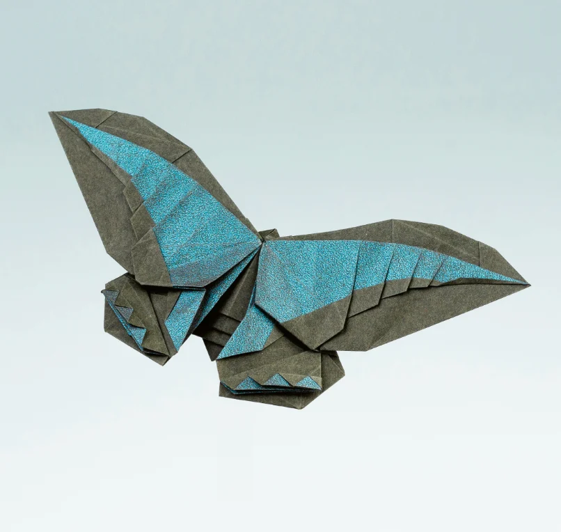 Origami Blue Triangle Butterfly designed by Đặng Việt Tân, folded by Đặng Việt Tân, using Shadow Fold paper
