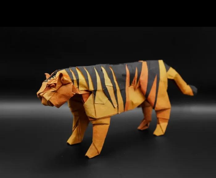 Origami Tiger designed by Kamiya Satoshi, folded by Tony Chang, using Shadow Thai paper (#08 BLACK / SIENNA ORANGE)