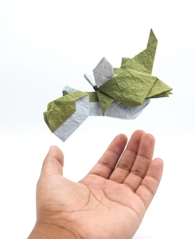 Origami Chubby Dragon designed by CHURA HUANCA Fernando, folded by Chura Huanca Fernando, using Yukogami paper (#10 Green /White)