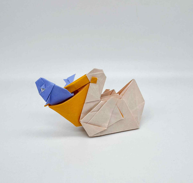 Origami Pelican designed by Syn / Jiahui Li, folded by Syn / Jiahui Li, using Luminous Thai paper (#08 White / Sienna Orange)