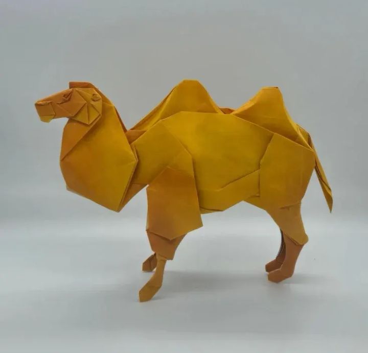 Origami Bactrian camel designed by Shuki Kato, folded by calerodriguezchristian, using Luminous Thai paper (#05 WHITE / YELLOW ORANGE)