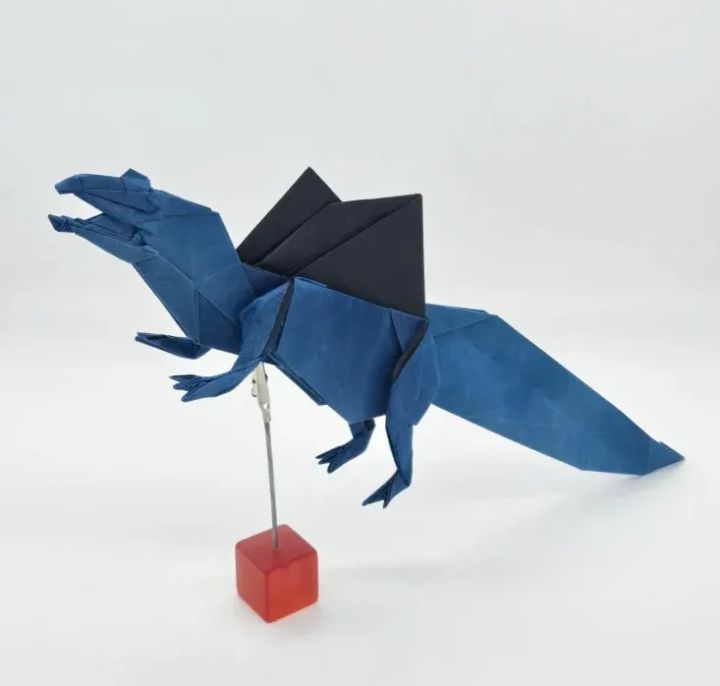 Origami Spinosaurus designed by Tu Kaiming, folded by calerodriguezchristian, using Shadow Thai paper (#04 BLACK / BLUE JEAN)