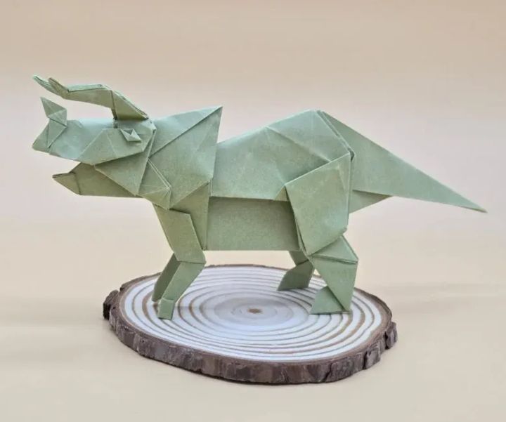 Origami Triceratops designed by Tu Kaiming, folded by calerodriguezchristian, using Vintage paper