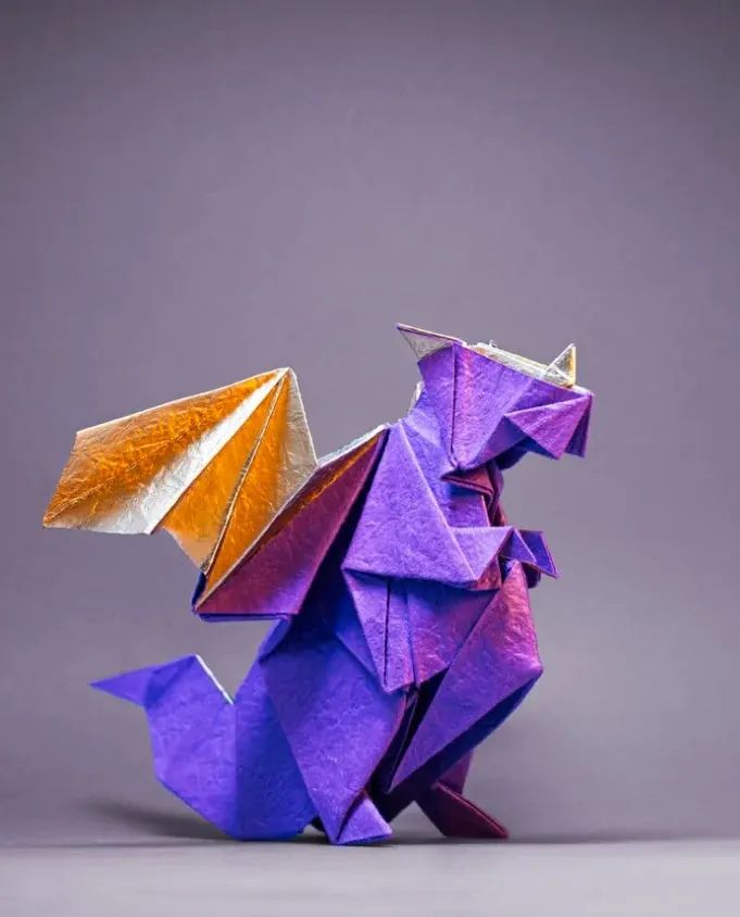 Origami Plump Dragon designed by Gen Hagiwara, folded by marvinbuete, using Washi Deluxe paper (Violet / Gold)