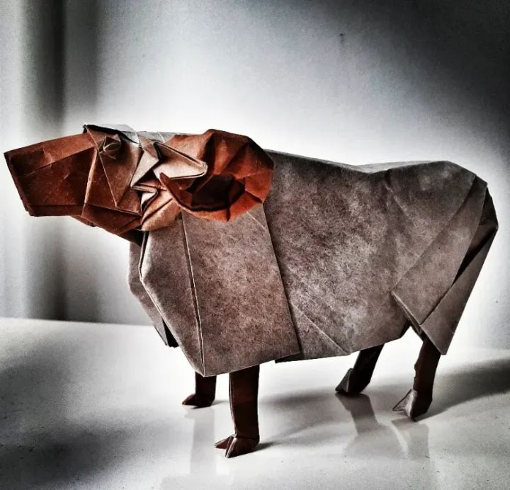 Origami Sheep designed by Kamiya Satoshi, folded by @pieter_van_dorsselaer, using Luminous Thai paper (#22 WHITE / BROWN)
